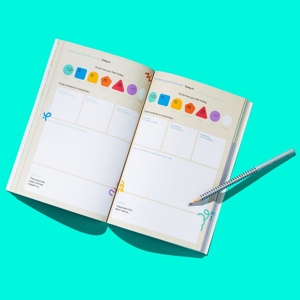 Open journal with colorful icons on a turquoise background